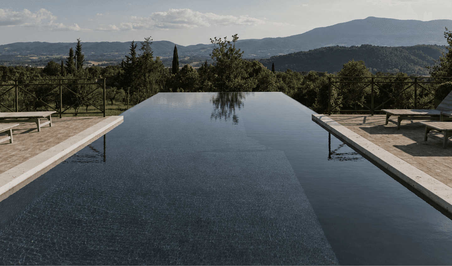 Idea infinity pool overlooking a mountain landscape